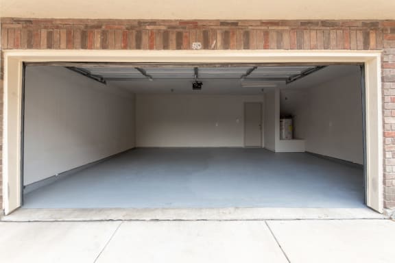 This is a photo of the 2-car garage with direct access to the 1486 square foot 3 bedroom, 3 bath floor plan at The Brownstones Townhome Apartments in Dallas, TX.