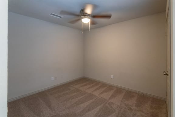 This is a photo of the third bedroom of the 1486 square foot 3 bedroom, 3 bath floor plan at The Brownstones Townhome Apartments in Dallas, TX.