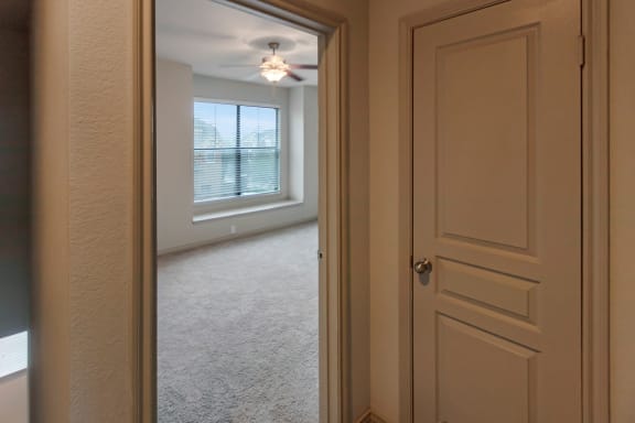 This is a photo of the third floor hallway of the 1661 square foot 3 bedroom, 3 and a half bath floor plan at The Brownstones Townhome Apartments in Dallas, TX.