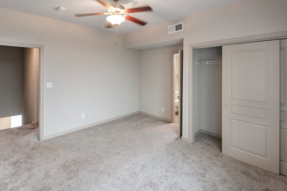 This is a photo of the second bedroom 1661square foot 3 bedroom, 3 and a half bath floor plan at The Brownstones Townhome Apartments in Dallas, TX.