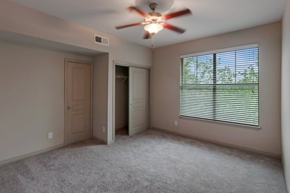 This is a photo of the second bedroom 1661square foot 3 bedroom, 3 and a half bath floor plan at The Brownstones Townhome Apartments in Dallas, TX.