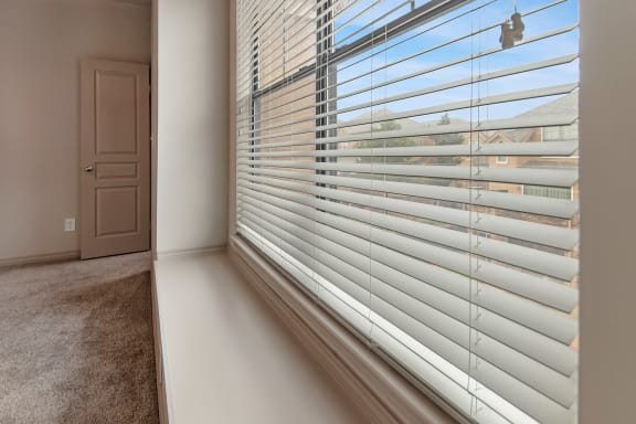 This is a photo of the recessed window in the master bedroom of the 1661 square foot 3 bedroom, 3 and a half bath floor plan at The Brownstones Townhome Apartments in Dallas, TX.