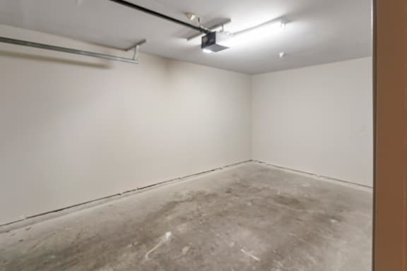 This is a photo of the direct access, 1-car garage of the 1661 square foot 3 bedroom, 3 and a half bath floor plan at The Brownstones Townhome Apartments in Dallas, TX.