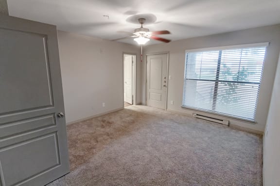 This is a photo of the first floor bedroom in the 1661 square foot 3 bedroom, 3 and a half bath floor plan at The Brownstones Townhome Apartments in Dallas, TX.