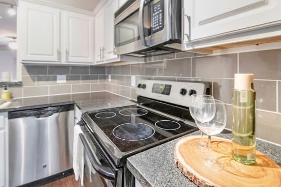 This is a photo of the kitchen of the 1661square foot 3 bedroom, 3 and a half bath floor plan at The Brownstones Townhome Apartments in Dallas, TX.