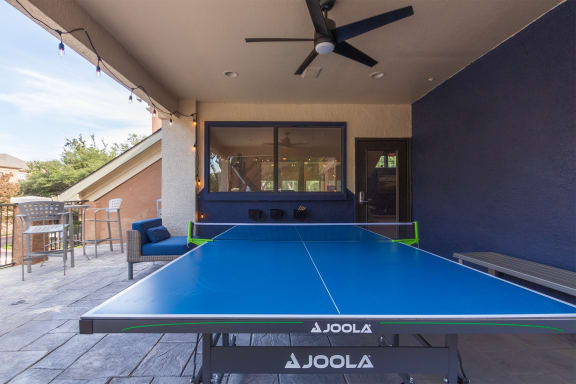 This is a photo of the ping pong table on the game deck at The Brownstones Townhome Apartments in Dallas, TX.