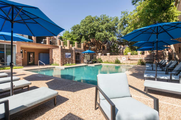 This is a photo of the pool area at The Brownstones Townhome Apartments in Dallas, TX.