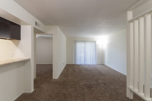 living room from the dining area of the 846 square foot 2 bedroom, 2 bath apartment  at The Biltmore, Dallas, 75231