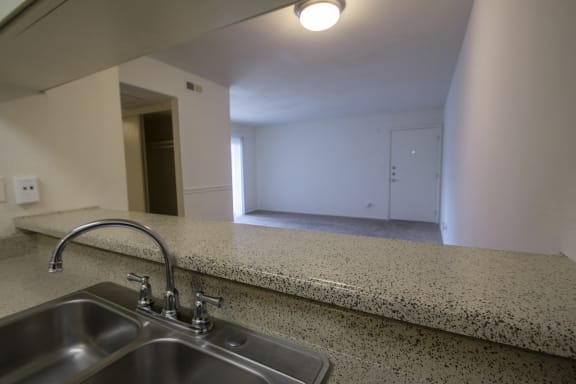Kitchen Looking Into Living Area at The Biltmore, Dallas, 75231