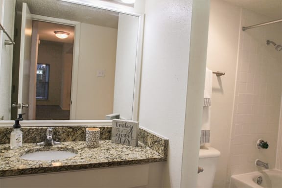 This is a photo of one of the bathrooms in the 1245 square foot 2 bedroom apartment at Cambridge Court Apartments in Dallas, TX.
