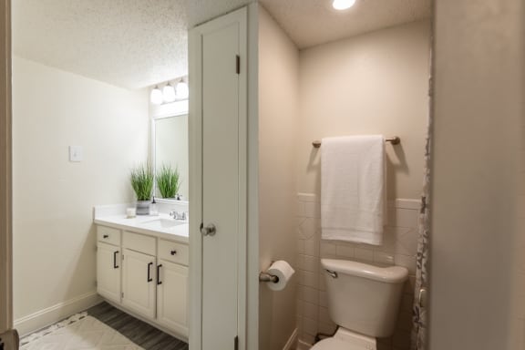 This is a photo of the bathroom in a 692 square foot 1 bed, 1 bath model aprtment at Cambridge Court Apartments in Dallas Texas