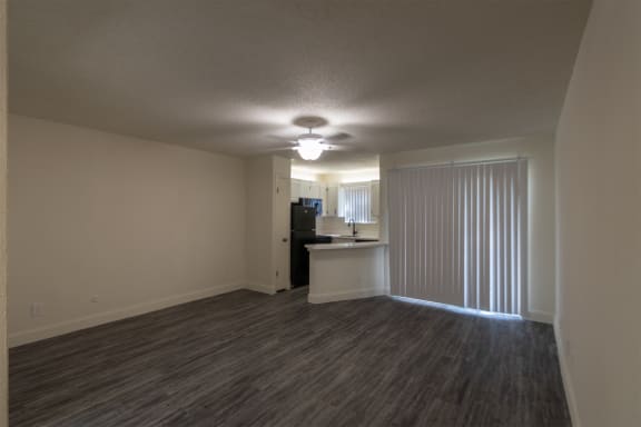 This is a photo of the living area in the 450 square foot efficiency apartment at Cambridge Court Apartments in Dallas, TX.