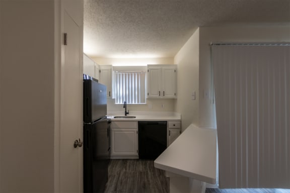 This is a photo of the kitchen in the 450 square foot efficiency apartment at Cambridge Court Apartments in Dallas, TX.