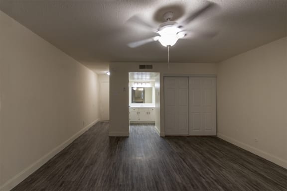 This is a photo of the living area in the 450 square foot efficiency apartment at Cambridge Court Apartments in Dallas, TX.