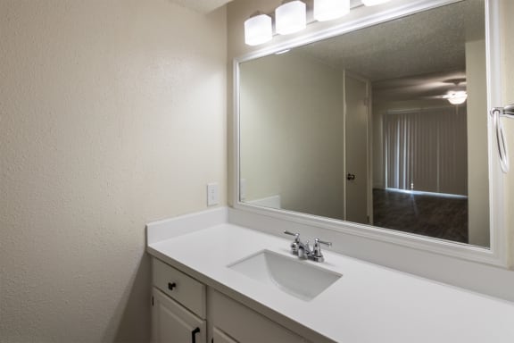 This is a photo of the bathroom vanity in the 450 square foot efficiency apartment at Cambridge Court Apartments in Dallas, TX.