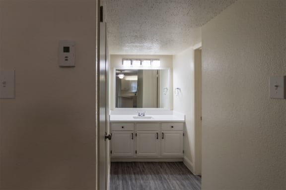 This is a photo of the bathroom vanity in the 450 square foot efficiency apartment at Cambridge Court Apartments in Dallas, TX.
