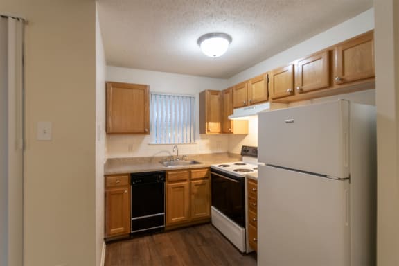 This is a photo of the kitchen in the 450 square foot efficiency apartment at Cambridge Court Apartments in Dallas, TX.