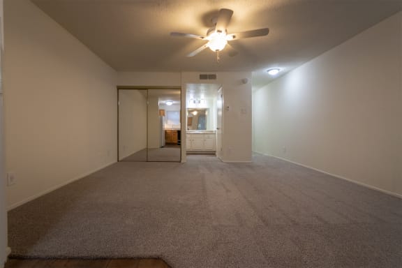 This is a photo of the living room in the 450 square foot efficiency apartment at Cambridge Court Apartments in Dallas, TX.