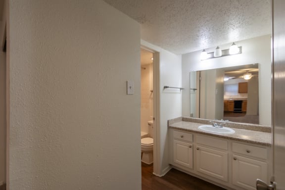 This is a photo of the bathroom vanity in the 450 square foot efficiency apartment at Cambridge Court Apartments in Dallas, TX.