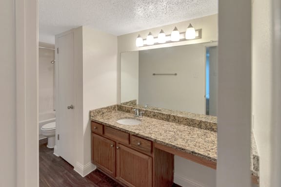 This is a photo of the bathroom in the 982 square foot 1 bedroom, 1 bath apartment at Cambridge Court Apartments in Dallas, TX.
