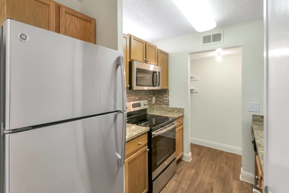 This is a photo of the kitchen in the 982 square foot 1 bedroom, 1 bath apartment at Cambridge Court Apartments in Dallas, TX.