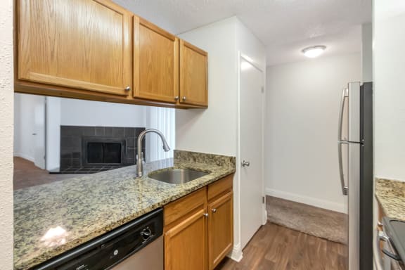 This is a photo of the kitchen in the 982 square foot 1 bedroom, 1 bath apartment at Cambridge Court Apartments in Dallas, TX.