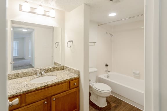 This is a photo of the full bathroom in the 1245 square foot 2 bedroom, 2 bath apartment at Cambridge Court Apartments in Dallas, TX.