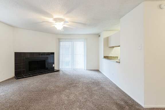 This is a photo of the living room in the 1245 square foot 2 bedroom, 2 bath apartment at Cambridge Court Apartments in Dallas, TX.