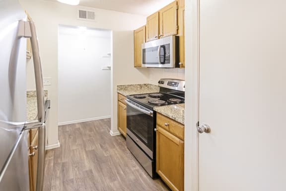 This is a photo of the kitchen in the 1245 square foot 2 bedroom, 2 bath apartment at Cambridge Court Apartments in Dallas, TX.