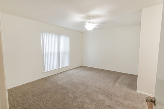 This is a photo of the primary bedroom in the 1245 square foot 2 bedroom, 2 bath apartment at Cambridge Court Apartments in Dallas, TX.