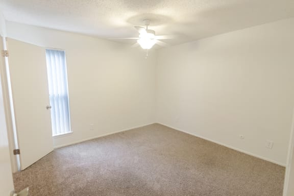 This is a photo of the second bedroom in the 1245 square foot 2 bedroom, 2 bath apartment at Cambridge Court Apartments in Dallas, TX.