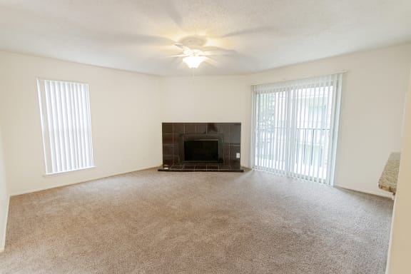 This is a photo of the living room in the 1245 square foot 2 bedroom, 2 bath apartment at Cambridge Court Apartments in Dallas, TX.