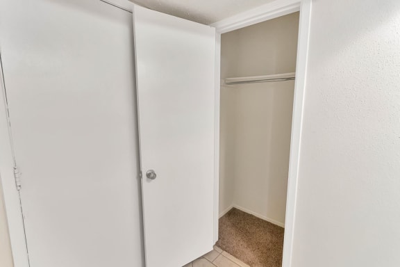 This is a photo of the entryway coat closet in the 1245 square foot 2 bedroom, 2 bath apartment at Cambridge Court Apartments in Dallas, TX.