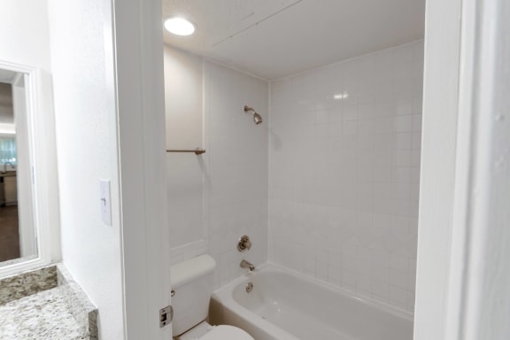 This is a photo of the bathroom in the 450 square foot efficiency apartment at Cambridge Court Apartments in Dallas, TX.