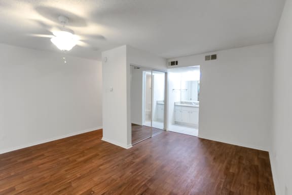 This is a photo of the living area in the 450 square foot efficiency apartment at Cambridge Court Apartments in Dallas, TX.