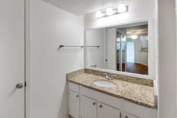 This is a photo of the bathroom in the 450 square foot efficiency apartment at Cambridge Court Apartments in Dallas, TX.