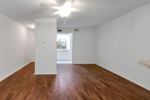 This is a photo of the living area in the 445 square foot efficiency apartment at Cambridge Court Apartments in Dallas, TX.