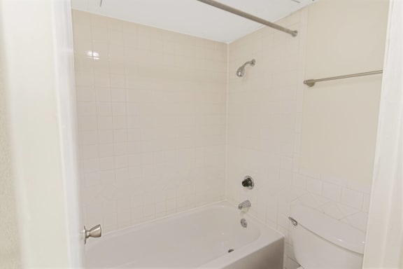 This is a photo of the bathroom in the 450 square foot efficiency apartment at Cambridge Court Apartments in Dallas, TX.