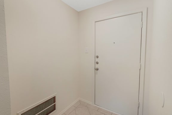 This is a photo of the entryway in the 450 square foot efficiency apartment at Cambridge Court Apartments in Dallas, TX.