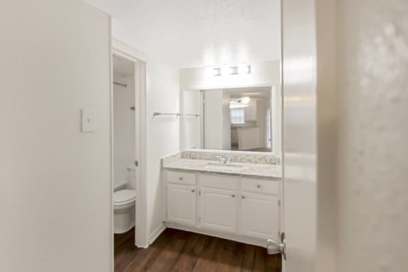 This is a photo of the bathroom in the 450 square foot efficiency apartment at Cambridge Court Apartments in Dallas, TX.