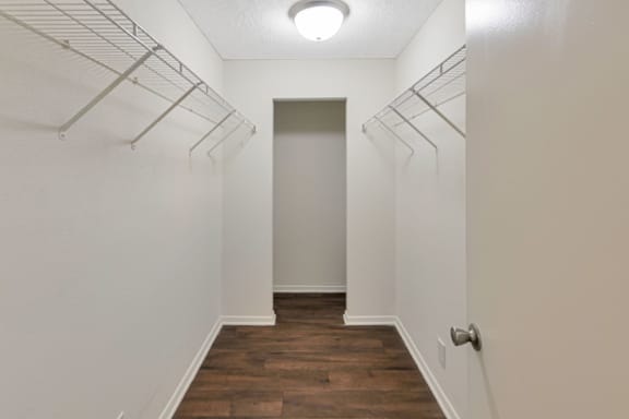 This is a photo of the huge walk-in closet in the 530 square foot efficiency apartment at Cambridge Court Apartments in Dallas, TX.