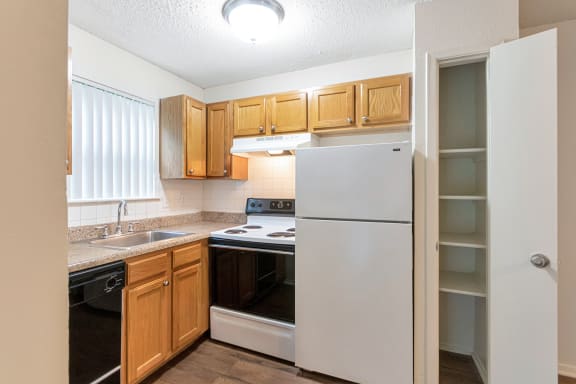 This is a photo of the kitchen in the 530 square foot efficiency apartment at Cambridge Court Apartments in Dallas, TX.