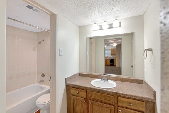 This is a photo of the bathroom in the 530 square foot efficiency apartment at Cambridge Court Apartments in Dallas, TX.