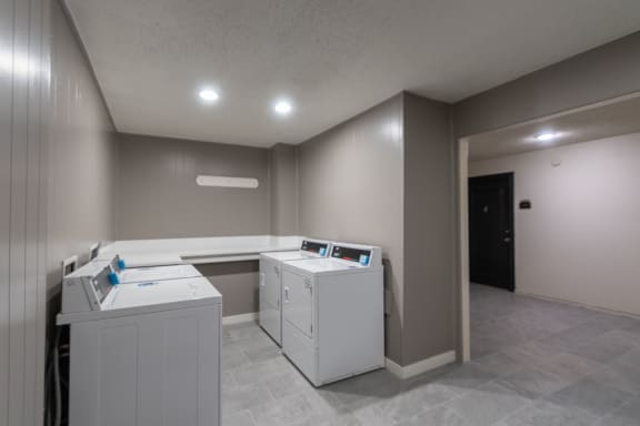 This is a photo of one of the seven community clothes centers at Cambridge Court Apartments in Dallas, TX.