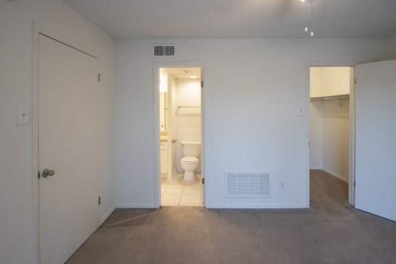 This is a photo of the bedroom of a 582 square foot 1 bedroom apartment at Cambridge Court Apartments in Dallas, TX.