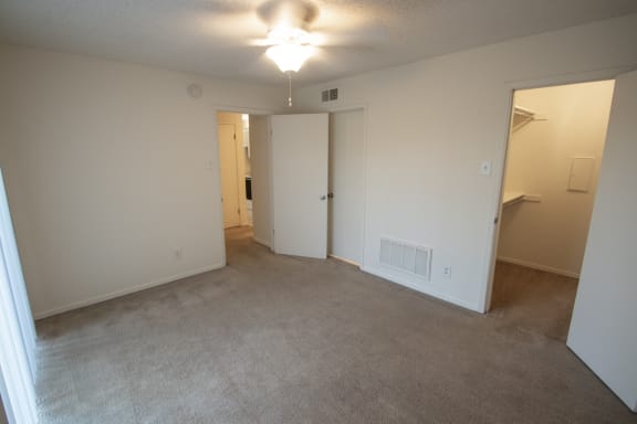 This is a photo of the bedroom of a 582 square foot 1 bedroom apartment at Cambridge Court Apartments in Dallas, TX.