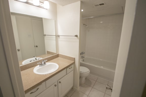 This is a photo of the bathroom of a 582 square foot 1 bedroom apartment at Cambridge Court Apartments in Dallas, TX.