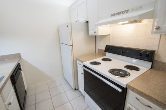 This is a photo of the kitchen of a 582 square foot 1 bedroom apartment at Cambridge Court Apartments in Dallas, TX.