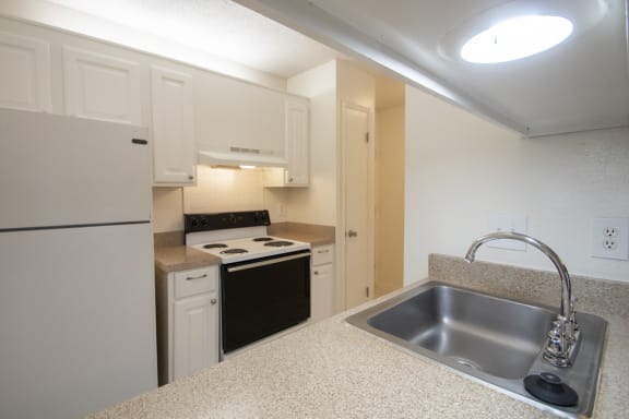 This is a photo of the kitchen of a 582 square foot 1 bedroom apartment at Cambridge Court Apartments in Dallas, TX.
