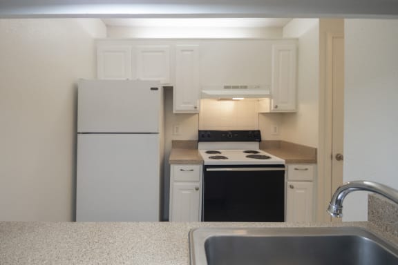 This is a photo of the kitchen of a 582 square foot 1 bedroom apartment at Cambridge Court Apartments in Dallas, TX.